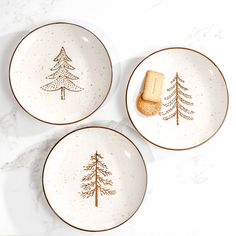 three plates with christmas trees and cookies on them