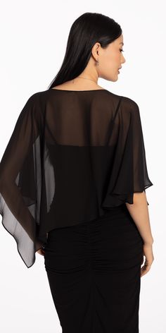 Introducing our Asymmetrical Chiffon Capelet, an accessory that adds a touch of elegance to any outfit. Made with delicate chiffon fabric, this capelet drapes gracefully over the shoulders, creating a sophisticated and exclusive look. Perfect for formal events. Pair it with Cubic Zirconia Drop Earrings and a dressy handbag to complete the look. Elegant Asymmetrical Blouse With Draped Sleeves, Elegant Blouse With Draped Asymmetrical Sleeves, Draped Tops For Evening, Elegant Draped Tops For Evening, Elegant Summer Top With Cape Sleeves, Elegant Chiffon Blouse For Night Out, Elegant Asymmetrical Drapey Tops, Elegant Party Top With Draped Sleeves, Elegant Draped Evening Tops