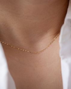 Add a touch of sparkle to any outfit with our Dainty Glitter Chain Necklace. The delicate chain captures the light in a beautiful way, making it a versatile piece to wear alone or layer with other necklaces. Embrace a subtle, yet glamorous look with this glitter daped chain. 14k Gold Spring ring clasp Minimalist Charm Necklace For Party With Delicate Chain, Minimalist Satellite Chain Necklace For Party, Dainty Necklace With Delicate Chain For Party, Minimalist Charm Necklace For Party, Dainty Charm Necklaces For Party, Delicate Charm Necklaces For Parties, Delicate Charm Necklace With Adjustable Chain For Party, Dainty Party Necklace With Satellite Chain, Dainty Yellow Gold Chain Necklace For Party