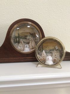 there are two snowmen in the clock on the mantle