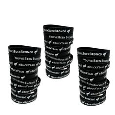 four black rubber bracelets with white words on them are stacked up in a row