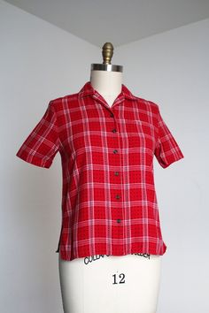 Really great cotton flannel button up top from the 1950s.  Label: none - likely homemade Measurements: { medium } Bust: 38"  Length: 23" Sleeve Length: 9" Condition: excellent vintage condition with minor signs of wear - sold as found. washed and ready to wear ☆Shop more☆ http://www.trunkofdresses.com/ Fashion 1940s, Womens Blouses, Plaid Top, Button Up Top, 50s Fashion, Plaid Tops, Cotton Blouses, Cotton Flannel, Plaid Flannel