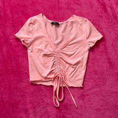 Light Pink Crop Top From Shein. Ruched In The Middle And Ties At The Bottom. Never Worn. Size: Xs. Condition: 10/10 Light Pink Crop Top, Ruched Crop Top, Pink Crop Top, Shein Tops, In The Middle, The Middle, Light Pink, Crop Top, Womens Tops