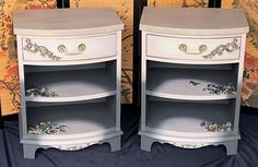 two white nightstands sitting next to each other