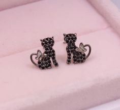 Introducing our gorgeous 14k gold plated kitty cat earrings, completely adorned with twinkly cubic zirconia crystals and a butterfly tail. Simple, timeless, delicate and elegant - a purrrrrrfect gift for any cat lover! Specifications Material: 14k Gold-plate & Cubic Zirconia Colours Available: Silver, Gold or Black Earring Size: Approx 1.3 cm x 0.8 cm Stud Back: Push-back Nickel Free, Hypoallergenic Delivery All deliveries are fully tracked and insured for your peace of mind. Elegant Cat Ears Jewelry With Cat Design, Party Jewelry With Cat Design And Cat Ears, Party Jewelry With Cat Design, Elegant Cat Ears Jewelry Gift, Elegant Cat Design Jewelry For Party, Elegant Party Jewelry With Cat Design, Butterfly Cat, Black Earring, Delicate Butterfly