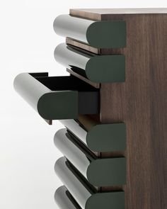 a close up of a wooden shelf with many drawers