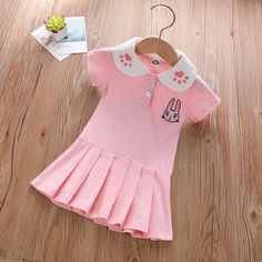 Toddler Girl College Style Polo Collar Dress Wholesale Children's Clothing - PrettyKid Fitted Doll Collar Dress For School, Pink Cotton School Dress, Pink Cotton Dress For School, Cute Pink Dresses With Cartoon Print, Fitted Pink Dress For School, Cute Pink School Dress, Playful Fitted Dress For School, Pink Short Sleeve Dresses With Cartoon Print, Pink Short Sleeve Dress With Cartoon Print