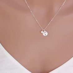 14k Gold Fill or Sterling Silver Sand Dollar and Freshwater Pearl. Beach Wedding Necklace. ★ ★★ It consists of .... -9mm 14k Gold Fill Sand Dollar Charm, -4-6mm Freshwater Pearl, -14k gold fill cable chain with spring claw. -Come up with ribbon gift box. -All quantities are available for bridesmaid gift. MORE SEA CHARM https://www.etsy.com/shop/rainbowearring/search?search_query=sea+charm&order=date_desc&view_type=gallery&ref=shop_search STERLING SILVER SAND DOLLAR https://www.etsy.c Minimalist Wedding Charm Necklaces, Sterling Silver Initial Pendant For Wedding, Sterling Silver Pearl Charm Necklace, Everyday Sterling Silver Necklace With Pearl Charm, Wedding Jewelry: Sterling Silver Initial Pendant, Wedding Jewelry With Sterling Silver Initial Pendant, Everyday Silver Jewelry With Pearl Charm, Wedding Sterling Silver Charm Necklace, Sterling Silver Charm Necklace With Pearl