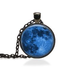 This listing is for a handmade art pendant, featuring: A Full Blue Moon. When you purchase this listing, you will receive one pendant with matching chain. Pendant size is 1 inch , chain length is 24 inches long with a lobster clasp.  Chains can be shortened or made longer (addition fee apply) at your request. Pendants are not 100% waterproof so showering, bathing, or swimming with your beautiful new pendant is not advised. Please review my policy page for the latest shop information and the most Moon Shaped Necklace With Large Pendant, Handmade Moon-shaped Artistic Jewelry, Handmade Artistic Moon-shaped Jewelry, Handmade Moon Shaped Artistic Jewelry, Blue Moon Charm Pendant Necklace, Moon Print Moon-shaped Necklace Gift, Moon Print Moon Shaped Necklace For Gift, Moon Print Moon Shaped Necklace Gift, Moon Shaped Necklace With Moon Print For Gift