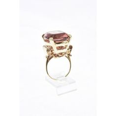 The Tourmaline is exquisite. The stone weights just over 32c.  It is a clean stone with a lovely rare color.  The 14k yellow gold mounting as scroll shoulders.  US size 7.25.  It can be sized. Elegant Formal Amethyst Ring With Large Stone, Formal Ruby Ring With Tourmaline Accents, Formal Yellow Gold Tourmaline Jewelry, Formal Ruby Ring With Gemstone Accents, Formal Morganite Sapphire Ring With Accent Stones, Formal Sapphire Ring With Morganite Accent Stones, Heirloom Ruby Ring With Gemstone Accents For Formal Occasions, 14k Gold Jewelry With Large Stone For Formal Events, Formal Fine Jewelry Topaz Ring With Large Stone