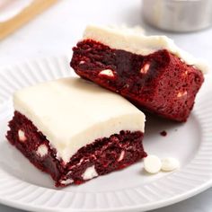 two pieces of red velvet cake on a plate