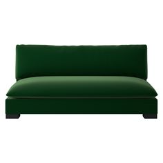 a green couch sitting on top of a white floor