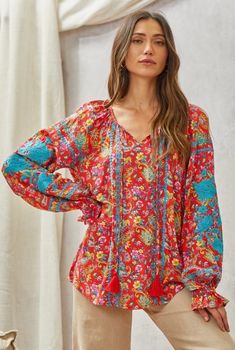 This tunic top features long sleeves with beautiful embroidery throughout the bodice. Long Sleeve Tops With Floral Embroidery For Summer, Casual V-neck Top With Multicolor Embroidery, Casual Embroidered V-neck Top For Fall, Casual Embroidered Long Sleeve Tops, Casual V-neck Blouse With Embroidered Sleeves, Casual V-neck Top With Embroidered Sleeves, Spring Bohemian Tunic Top, Bohemian Multicolor Tops With Blouson Sleeves, Bohemian Spring Tunic Top