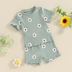 This JULIE Ribbed Summer Outfit is perfect for your little fashionista! The short sleeve shirt and matching shorts will keep her cool and stylish this summer. Perfect for any sunny day out. (Baby girls, we've got you covered!) Summer Sets With Short Sleeves, Cute Cotton Short Set For Summer, Spring Playwear Short Set, Spring Short Set For Playwear, Playful Cotton Short Set For Spring, Playful Cotton Short Set For Summer, Playful Short Sets For Spring, Playful Short Sleeve Sets For Spring, Playful Short Tops For Spring