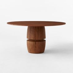 an oval wooden table with two pedestals on each side and one leg in the middle