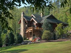 a large house surrounded by trees and grass