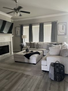 a living room filled with furniture and a fire place