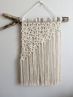 a white wall hanging on the side of a wall