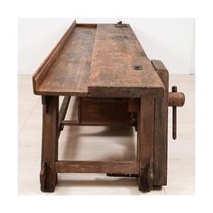 an old wooden table with drawers on top