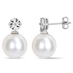 A classic look, these chic pearl drop earrings pair well with almost any attire. Fashioned in sterling silver, each anytime earring showcases a shimmering diamond accent - artfully set to enhance size and sparkle - atop a luminous 11.0-12.0mm cultured freshwater pearl. Buffed to a brilliant luster, these post earrings secure comfortably with friction backs. Classic White Pearl Earrings With Diamond Accents, Classic White Pearl Earrings With Cubic Zirconia, Classic White Cubic Zirconia Pearl Earrings, Classic White Round Cut Pearl Earrings, Classic White Pearl Earrings, Classic Diamond Teardrop Pearl Earrings, Classic Teardrop Diamond Pearl Earrings, Classic Silver Pearl Earrings, Classic White Earrings With Diamond Accents