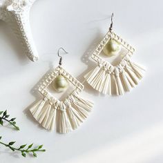 All Speck products were made by REAL Pacific Island women with REAL native Pacific Island materials. ITEM DESCRIPTION: These unique geometric earrings were made from finely woven Niau (young coconut leaf) fibers with a money cowrie shell centerpiece. Earrings measure 2" in wide and 2.25" tall. SHIPPING: Each piece is lovingly packaged within a velvet drawstring bag and carefully shipped within a bubble mailing envelope for extra protection. Your item(s) will be shipped within 1-3 days of the pur Island Women, Shell Centerpieces, Coconut Leaves, Saratoga Springs, Mailing Envelopes, Cowrie Shell, Fringe Earrings, Geometric Earrings, Real Women