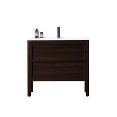 an image of a bathroom vanity with two bottles on the top and one drawer open