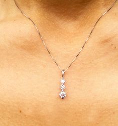 "14K WHITE GOLD, 0.75CTW ROUND CUT FOREVER ONE MOISSANITE, PRONG SET THREE STONE STYLE PENDENT THIS IS A VERY ELEGANT PIECE WITH THREE MAIN STONES (0.30,0.20,0.10CT EACH) THIS NECKLACE INCLUDES AN 18\" WHITE GOLD CHAIN Total weight is 0.75ct. DIAMONDS SPECIFICATIONS Metal : 14k Solid White Gold Stone Weight: 0.75CT, (4.5MM,4MM,3.5MM) Stone Shape: Round Stone Clarity: VVS Stone Color: D-E-F, FOREVER ONE MOISSANITE Certificate/Appraisal: Included Retail Appraisal Value: $1,500.00 * Larger/Smaller Wedding Pendant, Heirlooms Jewelry, Halo Earrings, White Gold Chains, Pendent Necklace, White Gold Wedding, Style Wedding, Diamond Stone, Three Stone