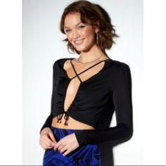 A Party Girl Necessity. Flirty Long Sleeve Top Featuring An Open Front Fastened With A Drawstring Cinched Cutout And Crisscross Straps Across The Chest. Bin 106 Chic Tops With Crisscross Straps For Night Out, Flirty Stretch Crop Top For Evening, Chic Stretch Crop Top With Cross-tied Detail, Stretch Crisscross Top For Night Out, Flirty Evening Stretch Crop Top, Stretch Crisscross Crop Top For Night Out, Crisscross Cross-tied Tops For Night Out, Chic Stretch Crisscross Tops, Chic Tops With Crisscross Straps For Date Night