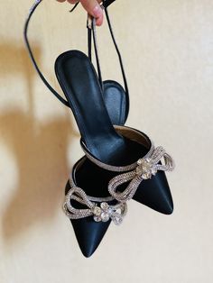 Rhinestone Bow Pointed Toe High Heel Sandals Black Rhinestone Sandals For Formal Occasions, Black High Heel Sandals With Rhinestones, Silver Sandals With Rhinestones For Events, Elegant Black Sandals With Rhinestones, Silver Rhinestone Event Sandals, Elegant Black Sandals With Bling, Black Bling Sandals For Party, Silver Rhinestone Evening Sandals, Silver High Heel Sandals With Bling