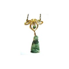 "The bow on this necklace gives such a unique touch to this circa 1920s pendant. The gold filled bow is delicately engraved and hosts a small jade ball that dangles between it's longer ribbons. Hanging from these ribbon is a jade Buddha. The pendant piece is attached to a yellow-gold filled paper-clip chain adorned with two additional small jade balls. The chain is held on your neck by a spring ring clasp of the old style. Unsigned. This pendant is in excellent condition and measures 20\" in its Elegant Jade Necklace With Large Pendant, Elegant Engraved Jade Necklace, Formal Art Deco Jade Jewelry, Art Deco Jade Jewelry For Formal Occasions, Elegant Jade Jewelry For Collectors, Elegant Collectible Jade Jewelry, Formal Green Engraved Necklace, Antique Jade Pendant Necklace, Vintage Jade Pendant Jewelry