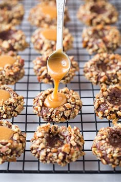 cookies with peanut butter being drizzled on top