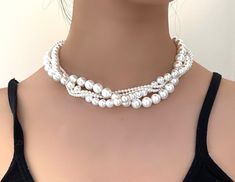 Elegant multi layers and sizes white shell pearl necklace choker. A fantastic gift for any occasion!  Handmade with high quality white tone shell pearl beads. Pearl sizes are 3mm, 6mm and 10mm.  The design is highly versatile to match your style. You can use it as double strand choker necklace, or just the 14mm pearl necklace only. The necklace features an easy to use spring ring clasp, and comes in a lovely jewellery gift box.  All our necklaces are completely handmade, and we can customize the colours and sizes for you. White Pearl Charm Choker Jewelry, White Pearl Pendant Necklace For Party, White Pearl Necklaces For Party, White Multi-strand Beaded Necklace With Pearl Drop, White Pearl Drop Choker Jewelry, White Pearl Pendant Jewelry For Party, Elegant White Choker Necklace, White Beaded Choker With Pearl Charm, White Beaded Necklace With Pearl Charm For Party