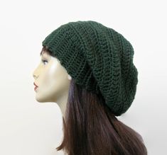 This is made to order. I crocheted this with a pretty forest green acrylic soft yarn. It has a slouch large enough to tuck lots of hair if you like. Hand wash is recommended. This should fit most adult heads. If you would like a different color please let me know. Please choose your size from the drop down menu. Green Crochet Beanie One Size, Green Crochet Hat Made Of Yarn, Green Acrylic Yarn Hat, One Size, Green Acrylic Yarn Hat One Size, Green Crochet Beanie One Size Fits Most, Green Acrylic Beanie, Green Crochet Hat In Acrylic Yarn, Green Slouchy Yarn Hat, Green Crochet Hat For Fall