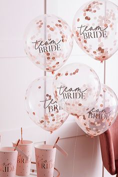 balloons and streamers with team bride written on them