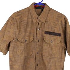 Description:Vintage brown Harley Davidson short sleeve shirt, fits medium.GENDER: mens CONDITION: very good.STYLE: short sleeve shirtERA: 2000sCOLOUR: brownFABRIC: cotton Brown Cotton Shirt With Pockets, Brown Button-up Shirt With Pockets, Brown Collared Tops With Pockets, Casual Brown Button-up Camp Shirt, Fitted Brown Collared Shirt, Fitted Collared Brown Shirt, Casual Fitted Brown Shirt, Brown Casual Cotton Shirt, Brown Cotton Casual Shirt