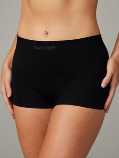 Savage, seamless, and super smooth, our Seamless Boy Short Panty was designed for all-day comfort and features a wide high-rise waist. Made from a soft, seam-free material that stretches over your curves and holds you in all the right places. Seamless Athletic Shorts For Sports, Versatile Smoothing Stretch Shapewear, Versatile Seamless Shapewear, Solid Seamless Boxer Briefs For Loungewear, Seamless Yoga Bottoms, Solid Seamless Shapewear In Elastane, Solid Color Seamless Shapewear, High Waist Seamless Bottoms With Minimal Stretch, High Waist Bottoms With Minimal Stretch