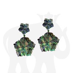 JE0427 'Innate' Mother of Pearl Flower Earrings with Tsavorite in 18K Yellow Gold and Black Rhodium Approx Wt: 31.55 Carats (Mother of Pearl), 0.78 Carats (Tsavorite) Luxury Green Pierced Earrings, Luxury Green Earrings With Polished Finish, Green Luxury Pierced Earrings, Green Luxury Earrings, Formal Tsavorite Earrings Fine Jewelry, Luxury Green Multi-stone Earrings, Luxury Gemstone Flower-shaped Earrings, Formal Green Jewelry With High Luster, Luxury Green Clip-on Jewelry