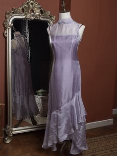 Elevate your wardrobe with this exquisite two-piece set, combining timeless elegance with contemporary flair. The Light Purple Vintage Slip Dress exudes a nostalgic charm with its delicate hue and classic silhouette, featuring adjustable spaghetti straps for a perfect fit. The soft, flowing fabric gracefully drapes over your figure, creating an ethereal look that's perfect for both daytime outings and evening soirées.  Complementing the slip dress is a sophisticated High Neck Sleeveless Asymmetr Asymmetrical Hem Evening Dress For Summer Weddings, Summer Wedding Evening Dress With Asymmetrical Hem, Elegant Asymmetrical Hem Evening Dress For Wedding, Elegant Wedding Dress With Overlay, Formal Sleeveless Dress With Overlay, Spring Wedding Evening Dress With Asymmetrical Hem, Fitted Wedding Dress With Overlay, Fitted Evening Dress With Asymmetrical Hem For Spring, Elegant Sleeveless Dress With Overlay