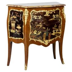 an ornate wooden cabinet with painted designs on it