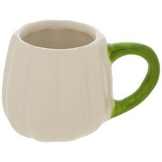 a white and green coffee mug on a white background with the handle slightly bent down