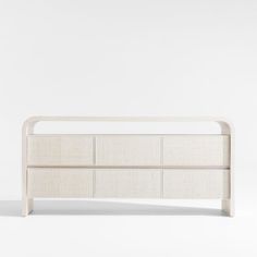 a white bed frame with four drawers