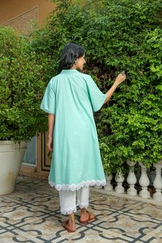 Dusty jade kurtapant set is perfect for a festive season or a day out .Cotton cambric fabric makes it perfect for summer weather. Front v-neckline kurta with lace detail bell sleeves give a classic look. Product has no lining. Pant has two side pockets, back elasted waistband and lace on the hem. Cold wash and Dry clean only.Type of Work: Solid Fit: Loose Model Height: 5'7 Measurements: Kurta-36.5" Pant- 34" SKU#: 11702071GR Disclaimer: There may be slight difference in actual product color comp Wings Dress, Summer Weather, Kurta With Pants, Pant Set, Days Out, Festive Season, Body Measurements, Model Height, Classic Looks