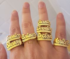 A name ring is a unique and personal way to express your identity and style. Whether you want to wear your own name, a loved one's name, or a meaningful word, you can customize your ring with up to 10 letters in a beautiful script font. The ring is made of high-quality sterling silver with a choice of gold or rose gold overlay for a stunning finish. The ring comes in a lovely gift box and is available in different sizes. A name ring is a perfect gift for yourself or someone special on any occasi Promise Ring With Custom Nameplate, Custom Name Plate Ring For Promise, Customizable Nameplate Promise Ring, Gold Engraved Ring With Custom Name For Promise, Silver Nameplate Engraved Ring, Silver Engraved Nameplate Ring, Silver Engraved Nameplate Ring With Custom Name, Custom Name Adjustable Nameplate Ring, Nameplate Rings Suitable For Gifts