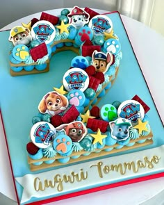 a birthday cake with paw patrol characters on it's number one, and the number two