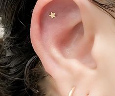 "These minimalist stud earrings are tiny stars made of solid 14k gold. The minimal look is perfect for everyday, in the second hole or as a unisex (men's) style. These earrings would make wonderful gift! All Sela + Sage jewelry comes in a matte black gift box - free bridesmaid thank you cards are provided as well! ►Matching moon studs also available: https://www.etsy.com/listing/950976790/gold-crescent-moon-stud-earrings-solid ►Discounts available for multiple items purchased, free \"bridesmaid Minimalist Star-shaped Hypoallergenic Cartilage Earrings, Minimalist Hypoallergenic Star Cartilage Earrings, Minimalist Hypoallergenic Star Piercings, Minimalist Star-shaped Single Cartilage Earring, Minimalist Star-shaped Cartilage Earrings With Star Charm, Sage Jewelry, Bridesmaid Thank You Cards, Bridesmaid Thank You, Star Stud Earrings