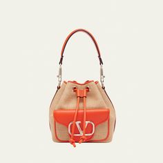 Valentino Garavani "Loco" bucket bag in polyester, metal, and raffia  Detachable flat top handle  Detachable, adjustable web shoulder strap Can be worn as a top handle or shoulder bag  Drawstring closure  Exterior, VLOGO front flap pouch  Lining: Cotton Approx. 7.5"H x 6.3"W x 4.3"D Made in Italy Designer Top Handle Bucket Bag For Errands, Designer Bucket Bag With Dust Bag For Errands, Designer Bucket Satchel With Handles, Designer Bucket Bag With Detachable Handle, Designer Tote Bucket Bag With Detachable Handle, Designer Bucket Satchel With Detachable Handle, Designer Crossbody Bucket Bag For Shopping, Designer Bucket Bag With Detachable Strap For Errands, Designer Bucket Hobo Bag For Shopping