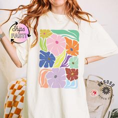 This floral shirt is the perfect gift for your favorite gardener! ❤️ 📲 HOW TO ORDER SHIRT 1.Click "Add to Cart": Once you've made your selections, click the "Add to Cart" button.  2.Review Shipping Details: Double-check your shipping address and order details to ensure accuracy. 3.Rest Easy and Relax: You did it! Your shirt is on its way, worry-free and ready for gifting! 🌊 CARE INSTRUCTIONS -Machine wash warm, inside out, with like colors -Only non-chlorine bleach, tumble dry low -Medium iron Spring Multicolor Print Cotton T-shirt, Spring Multicolor Cotton T-shirt, Multicolor Crew Neck T-shirt With Plant Print, Colorful Cotton Shirt For Spring, Spring Multicolor T-shirt With Screen Print, Spring Multicolor Screen Print T-shirt, Multicolor Screen Print T-shirt For Spring, Colorful Graphic Print T-shirt For Spring, Multicolor Printed Tops For Spring