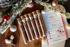 a bunch of christmas crackers sitting on top of a wooden table