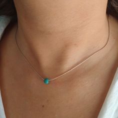 "Minimalist, wearable and delicate sterling silver necklace with turquoise beads. Length: available from 14\" (35cm) to 24\" (61cm). Width: turquoise bead 5 mm. Width 925 sterling silver chain: 0,66 mm. Strong 925 sterling silver lobster clasp. Handmade in Spain. Ideal for a gift and for combinate with other accessories. All our products are presented in a white organza bag. ♡ Made with love in Valencia ♡ ----------------------------- Discover the NICTE necklaces collection here: https://www.ets Turquoise Sterling Silver Necklace With Delicate Chain, Dainty Sterling Silver Turquoise Necklace, Dainty Turquoise Sterling Silver Necklace, Minimalist Turquoise Necklace, Minimal Choker, December Gift, Gold Armband, Moonstone Jewelry, 925 Sterling Silver Chain