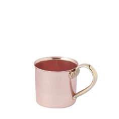 a pink coffee mug sitting on top of a white table